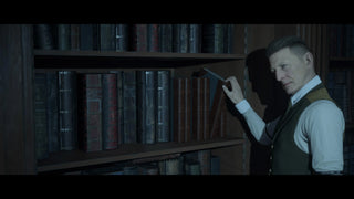 The Curator Dark Pictures Anthology — Pip Torrens as The Curator in the Repository library